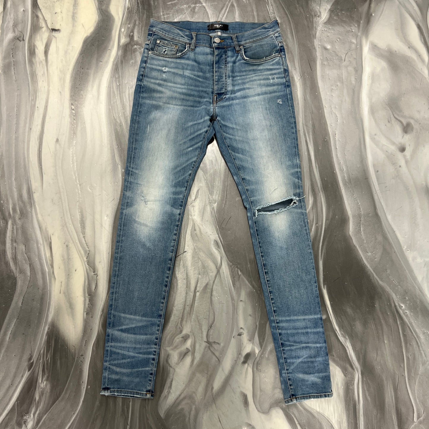 Amiri Light Wash Knee Slit Denim Jeans