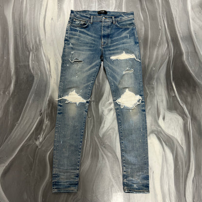 Amiri White Patch MX1 Light Wash Denim Jeans