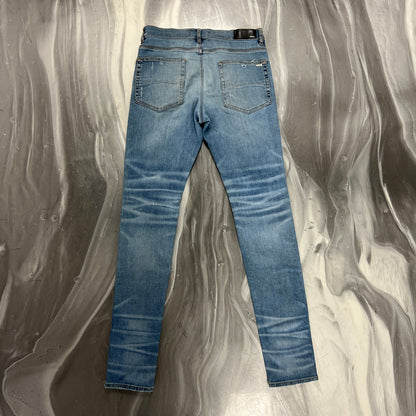 Amiri Light Wash Knee Slit Denim Jeans